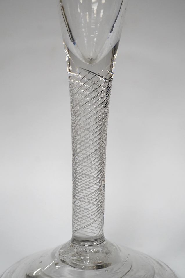 Two air twist stem drawn trumpet wine glasses, c.1750, the smaller example diamond point engraved ‘Miss Molly Strickland’, largest 19.2cm high. Condition - large wine glass - good, smaller glass - ground off foot and two